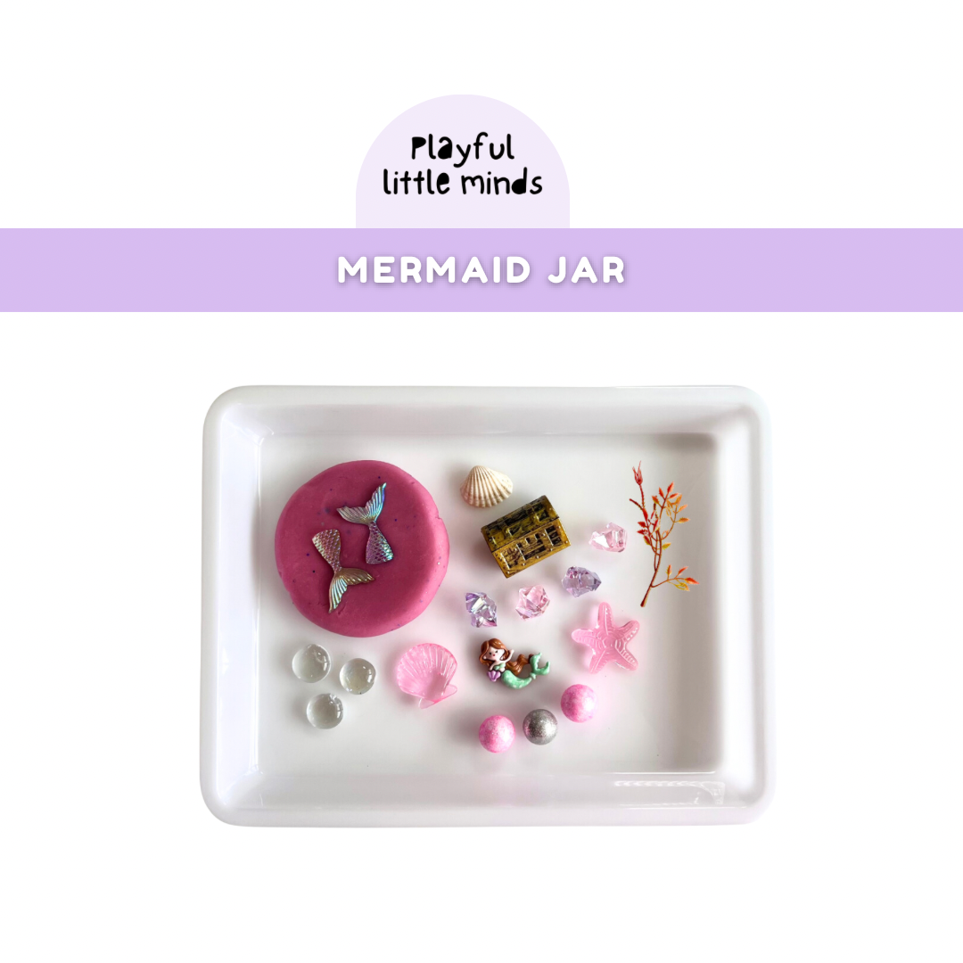 Play Dough Mermaid Play Jar flat lay showing all objects included in sensory jar.